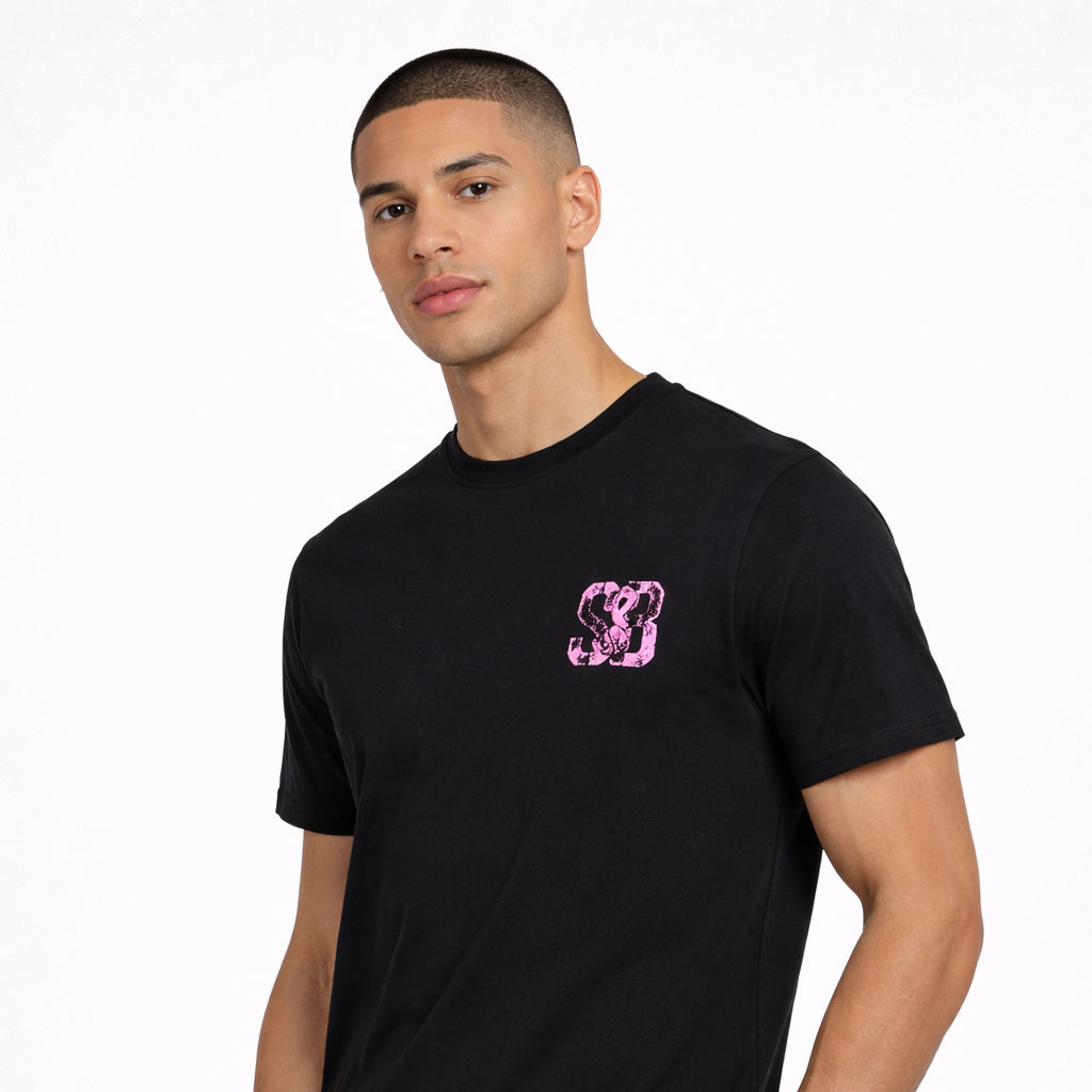 Angled view of Lilac Press Tee in black with lilac logo worn by model by Sauce & Brown