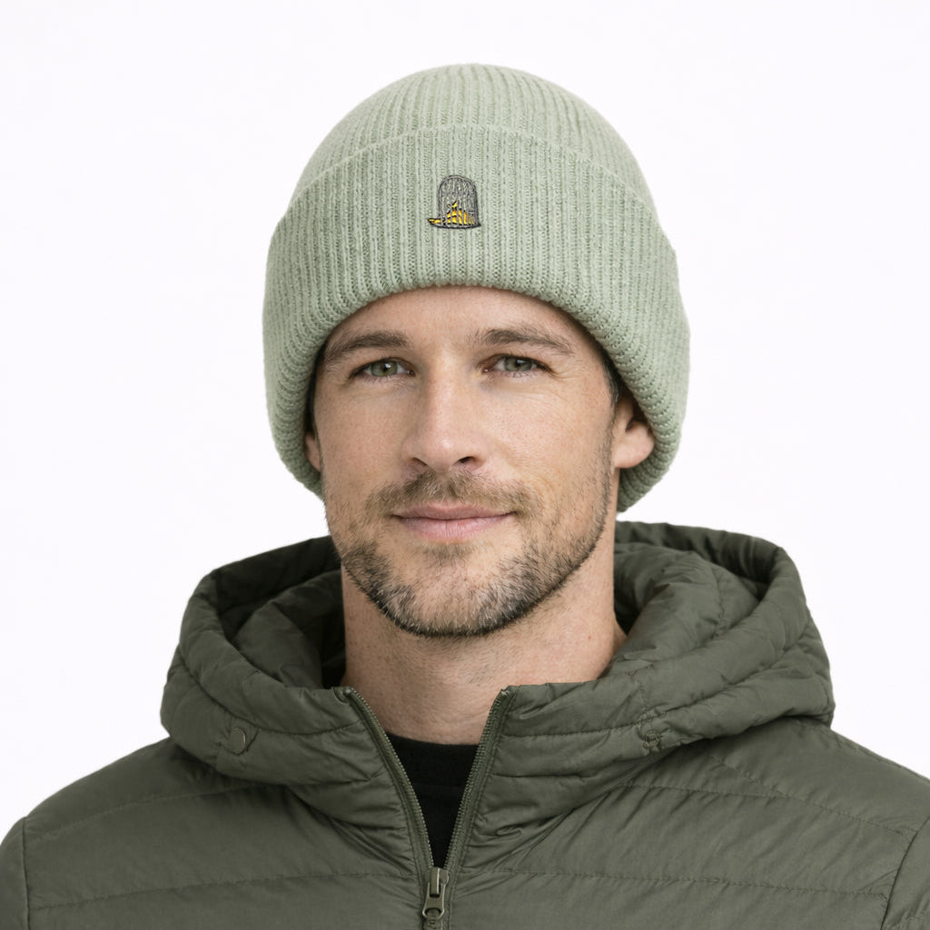 Model wearing Alpine Beanie in Alpine Green against neutral background by Sauce & Brown