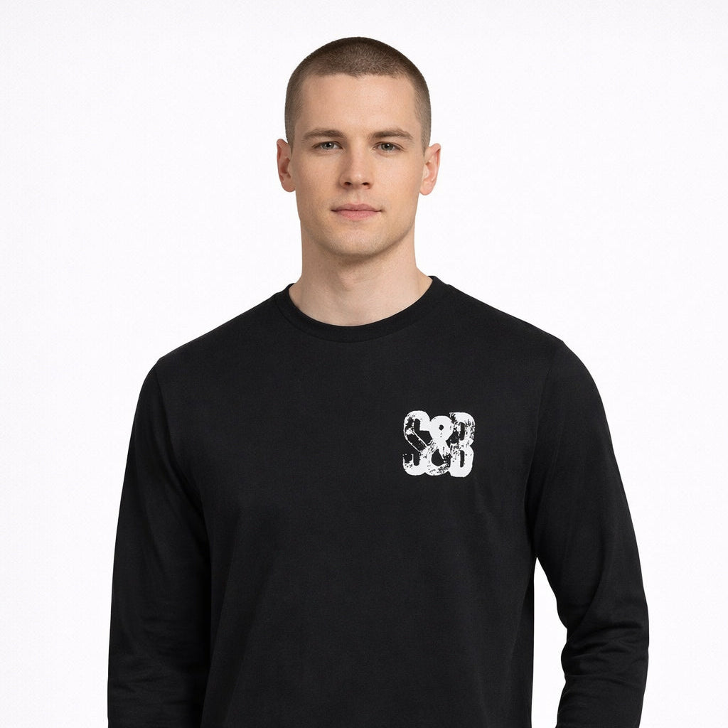 Miner Press Long Sleeve Tee in black with chest logo worn by model by Sauce & Brown
